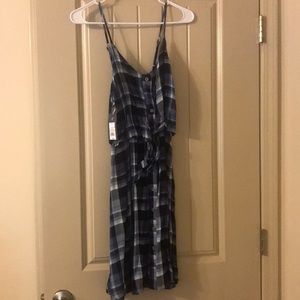 Super cute plaid dress.
